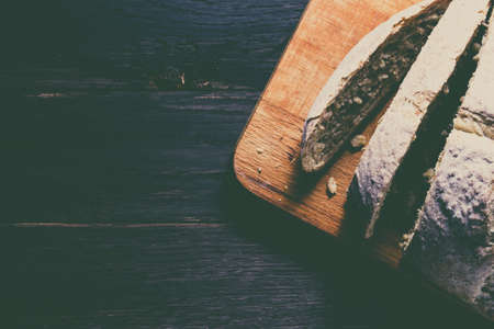 Fresh rye bread on dark background