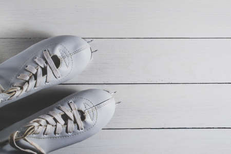 White children's skates on a white backgroundの写真素材