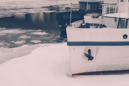 Old ships at the pier in iceの写真素材