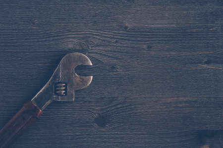 Old tools on a dark wooden background. Top viewの写真素材