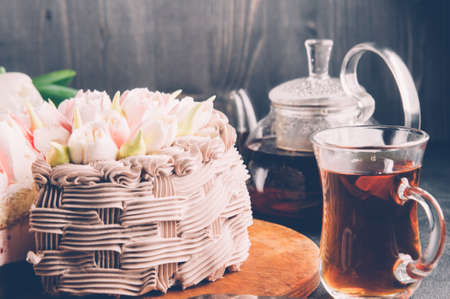 Cups of tea and cake on a dark backgroundの写真素材