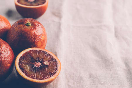 Red oranges on a dark stone backgroundの写真素材