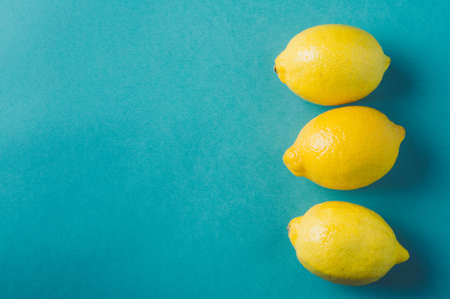 Lemons on green background
