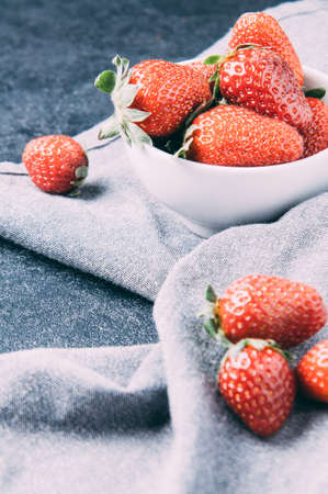 Ripe strawberry on a dark backgroundの写真素材