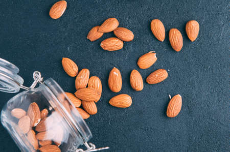 Almond nuts on a dark backgroundの写真素材