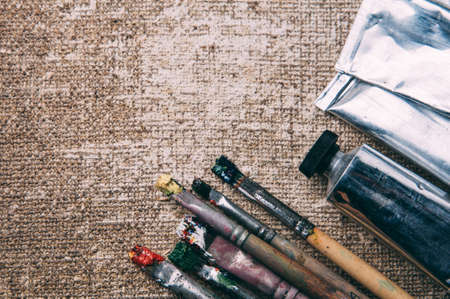 Brush and oil paint on the background of the canvasの写真素材