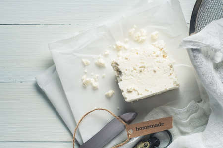Fresh homemade cheese on a light tableの写真素材