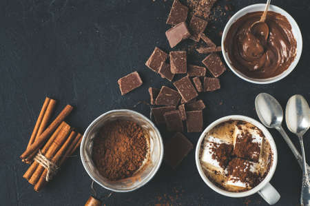 Cocoa, coffee and chocolate chips on dark concrete background.  Baking or cooking conceptsの写真素材