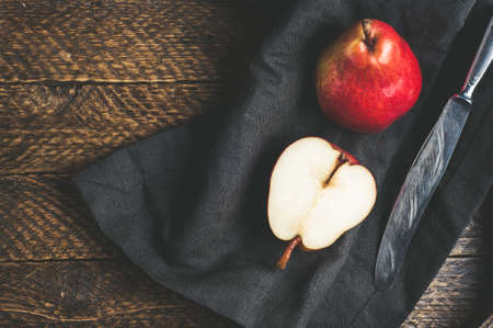 Red pears on old wooden tableの写真素材