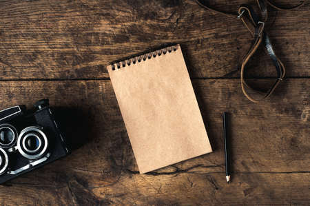 Retro camera and equpment on a wooden background