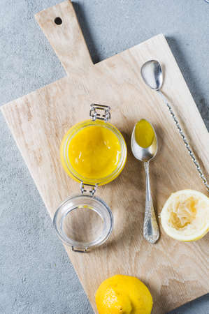 Lemon curd and ingredients on a gray concrete backgroundの写真素材