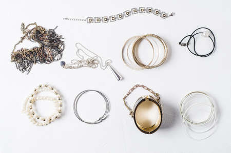 Fashion women's jewelry on a white concrete backgroundの写真素材