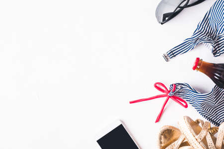 Retro style striped swimsuit and fashion accessories  on a white concrete backgroundの写真素材
