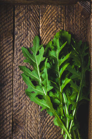 Fresh arugula in an old wooden boxの写真素材