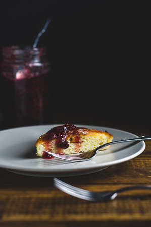 Portion of homemade pie with strawberry jam in a grey ceramic plateの写真素材