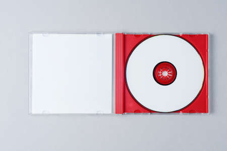 Blank CD on gray background. Mockup for branding