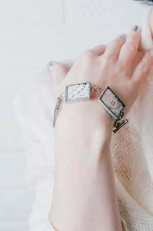 Bracelets and jewelry on a woman's handの写真素材