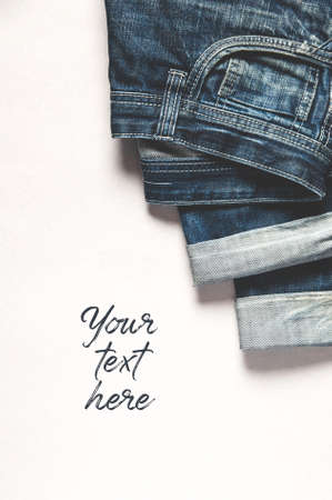 Men's jeans on grey background. Space for text or design