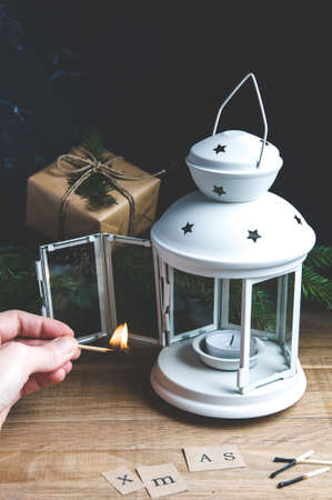 Lighting the Christmas lanternの写真素材