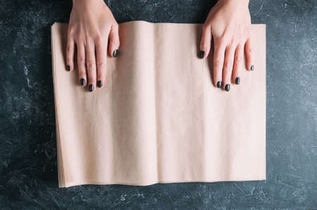 Baking paper on a dark background. Top view
