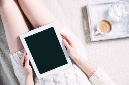 A woman holding a notepad in her hands. Template for text or design. Top view