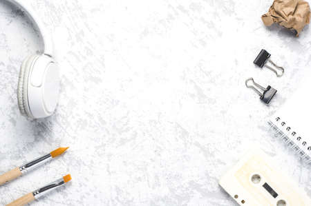 Headphones and stationery on white backgroundの写真素材