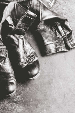 Leather boots and jacket on the concrete floor