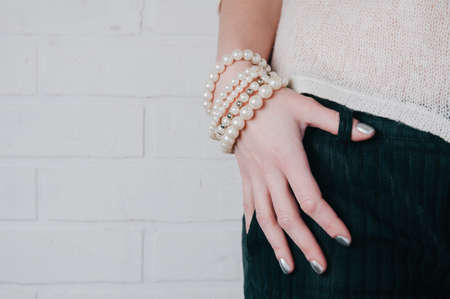 Bracelets and jewelry on a woman's handの写真素材