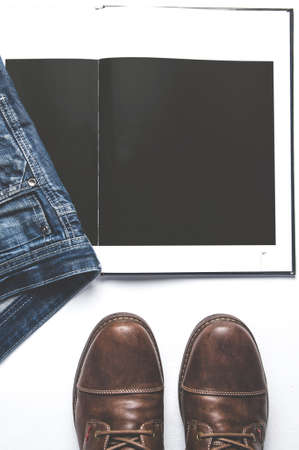 Men's clothing and book on white background. Template for text or designの写真素材