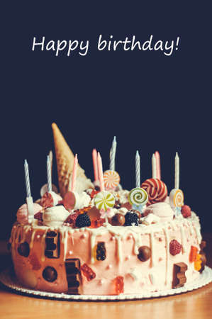 Homemade cake on a dark background, concept of holiday or birthdayの写真素材