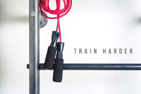Pink jump rope on white background. Fitness concept