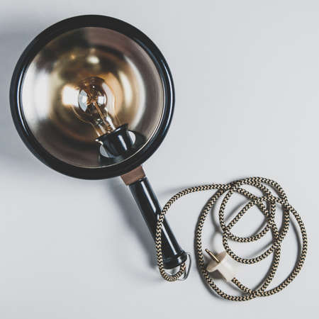 Old retro lamp on pale backgroundの写真素材