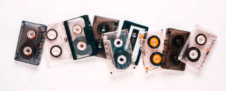 Old audio cassettes on a white background