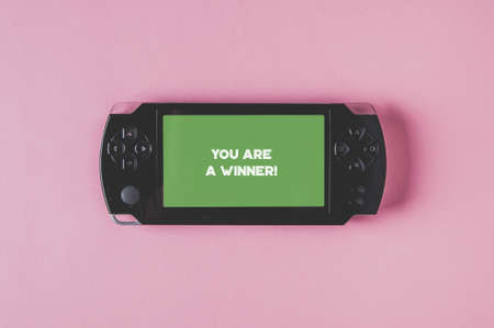 Old game console with an inscription on the monitor