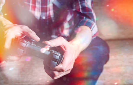 Game joystick in the hands of men