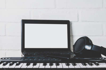 Synthesizer and laptop. The concept of a home Studio or recordingの写真素材