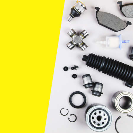 Set of car parts for maintenance on grey background