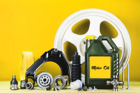 Set of car parts for maintenance or tuning on red backgroundの写真素材
