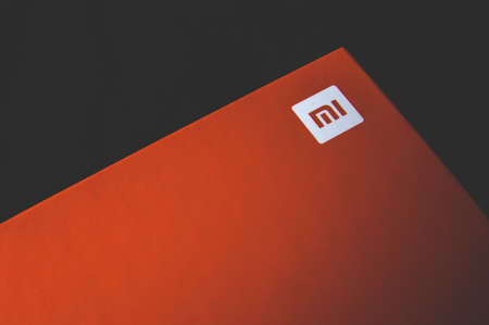 Russia, Moscow, October 02, 2019: The red box with the Xiaomi logo on a dark backgroundのeditorial素材