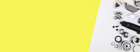 Set of car parts for maintenance on grey background