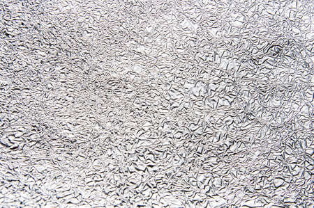 Silver foil texture close-up. Background for text or designの写真素材