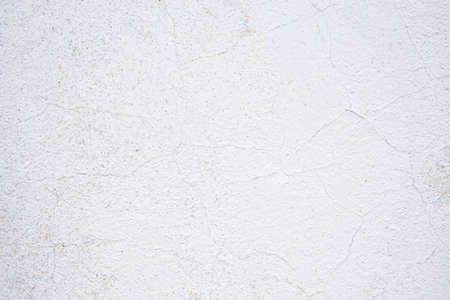 Texture of old cracked paint on the wall. White background for text or designの写真素材