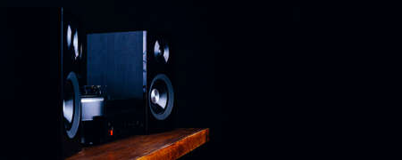 Vintage audio speakers, turntable and vinyl records on a dark backgroundの写真素材