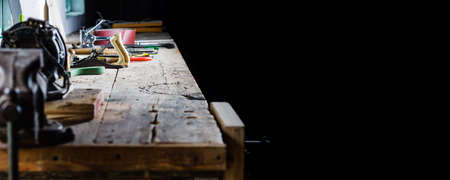 Tools on the workbench of the old workshopの写真素材