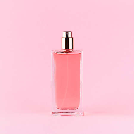 Perfume bottle on a light pink backgroundの写真素材