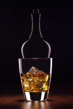 glass whiskey with bottleの写真素材