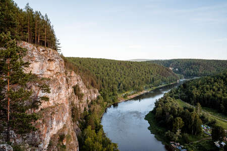 summer day on the river with rocky banks, blue sky, mountains, forest, landscape, river AI