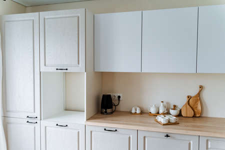 white tea set is in the kitchen, kitchen utensils, four cups