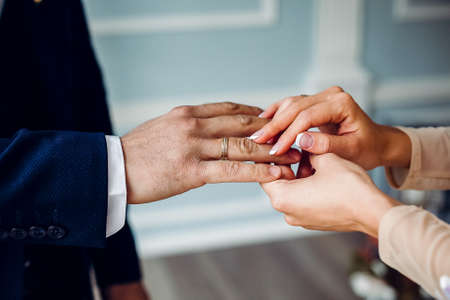 a man and a woman reach out to each other, two people holding hands, the concept of friendship, lend...