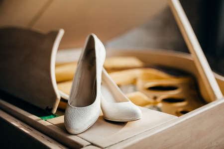 the bride's shoes are on the piano, the bride's wedding shoes.の写真素材